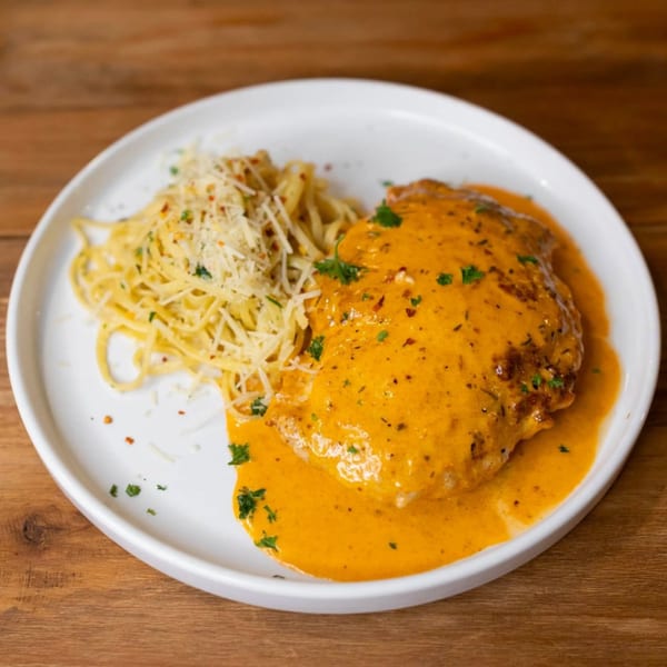 Andiamo Italian Grill's chicken with creamy orange sauce and a side of pasta with parmesan.